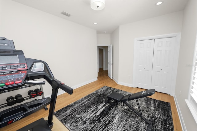 exercise room featuring hardwood / wood-style flooring