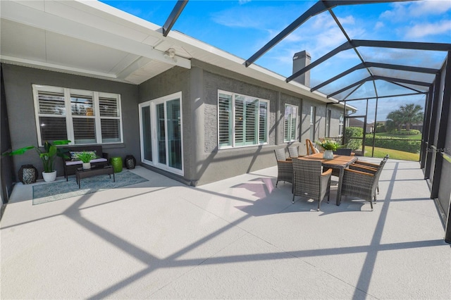 view of patio featuring an outdoor hangout area and glass enclosure