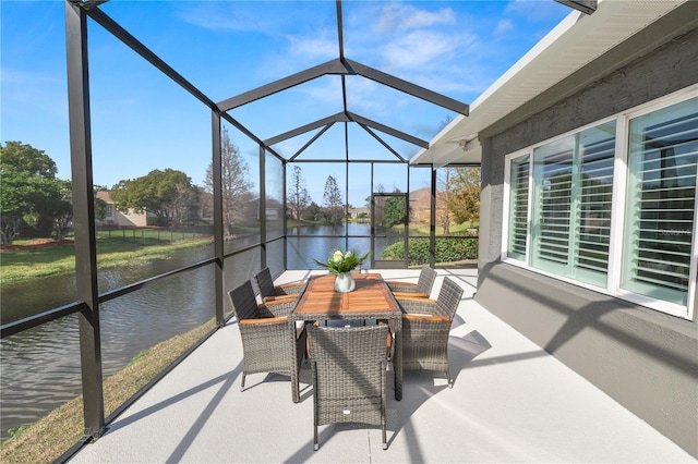 sunroom / solarium with a water view