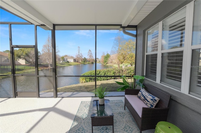 sunroom / solarium with a water view