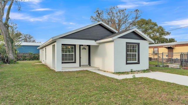 view of front of home with a front lawn