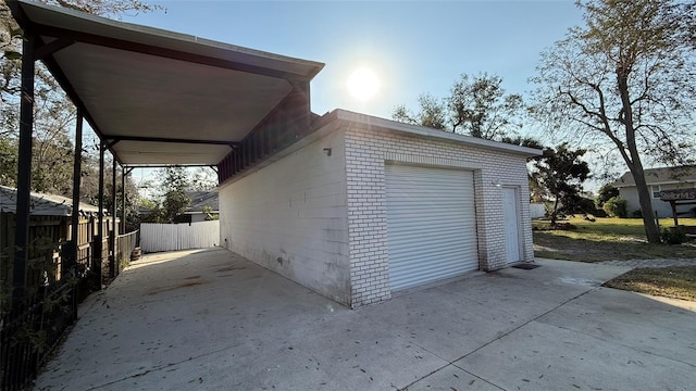 garage featuring a carport