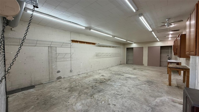 basement with brick wall and ceiling fan