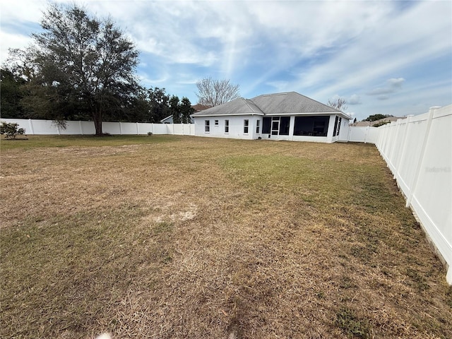 view of yard featuring a sunroom