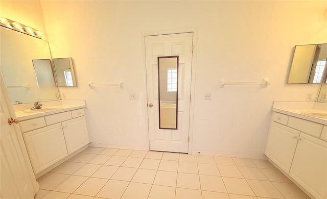 bathroom featuring tile patterned flooring and vanity