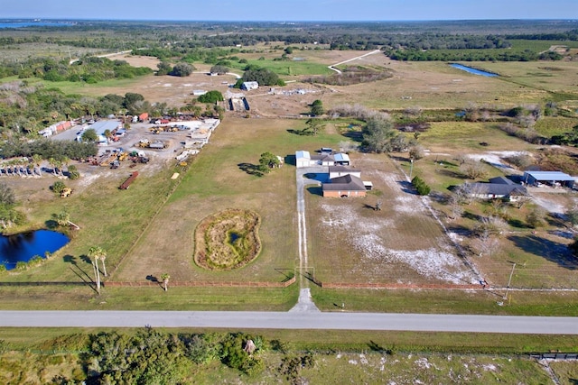 aerial view with a water view and a rural view