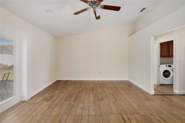 unfurnished room featuring ceiling fan, washer / dryer, and light hardwood / wood-style flooring