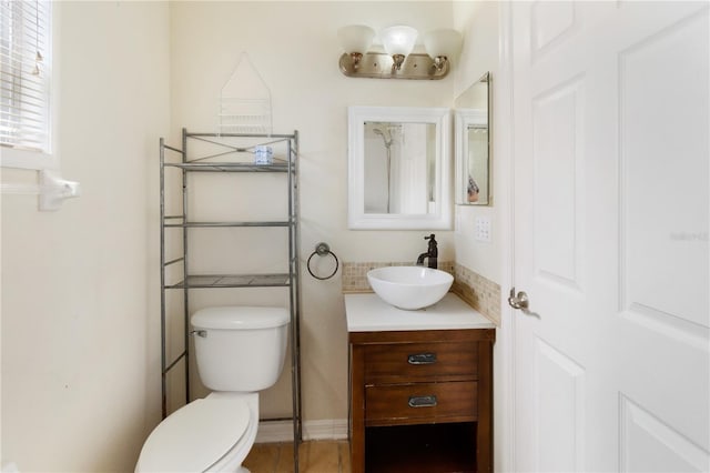 bathroom with vanity and toilet