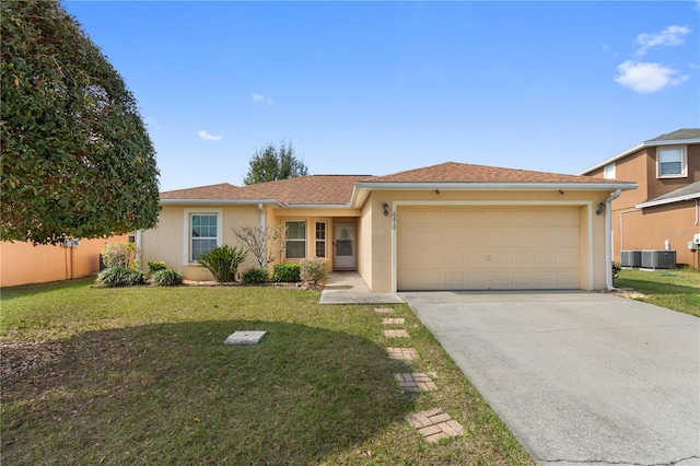 view of front of house with a garage and a front lawn