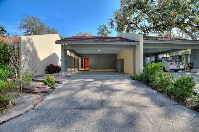 exterior space with a carport