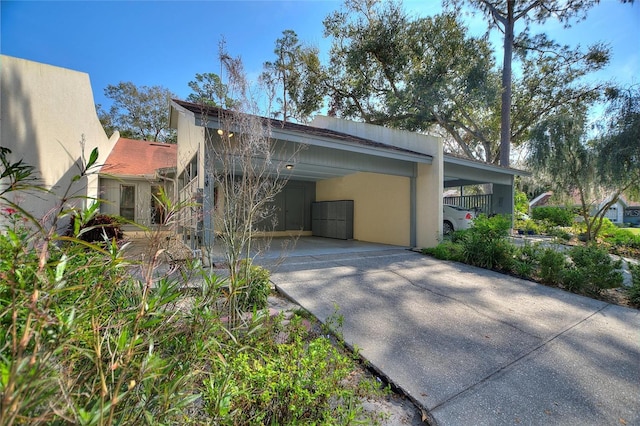 view of side of property with a carport