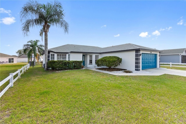 single story home with a garage and a front lawn