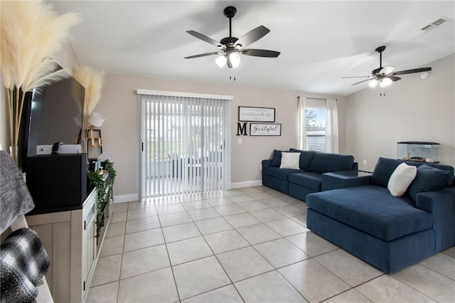 tiled living room featuring lofted ceiling and ceiling fan