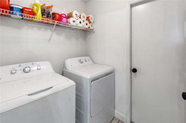 washroom with separate washer and dryer