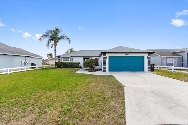 ranch-style home featuring a garage and a front yard