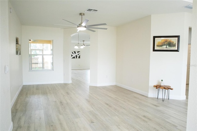 spare room with ceiling fan and light hardwood / wood-style floors