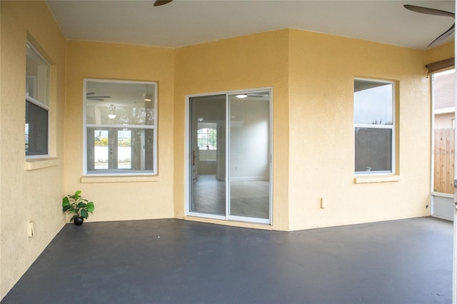 view of patio featuring ceiling fan