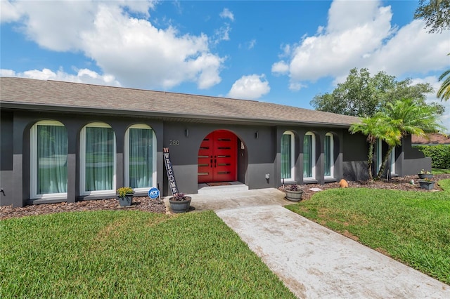 single story home with a front yard