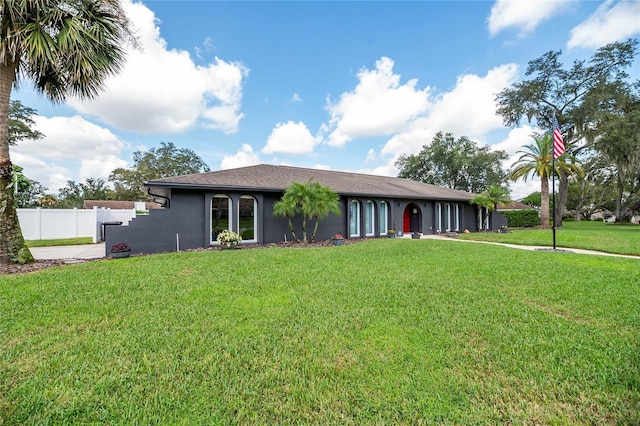 ranch-style house with a front lawn