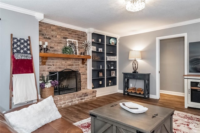 living room with a brick fireplace, ornamental molding, dark hardwood / wood-style floors, and a textured ceiling