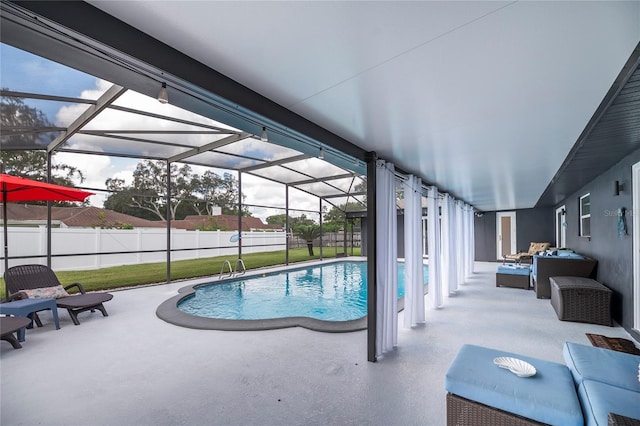 view of pool with an outdoor living space, a lanai, and a patio area