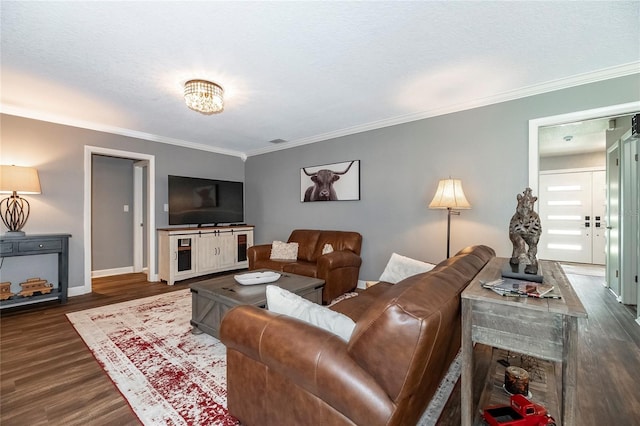 living room featuring a textured ceiling, visible vents, baseboards, ornamental molding, and dark wood finished floors