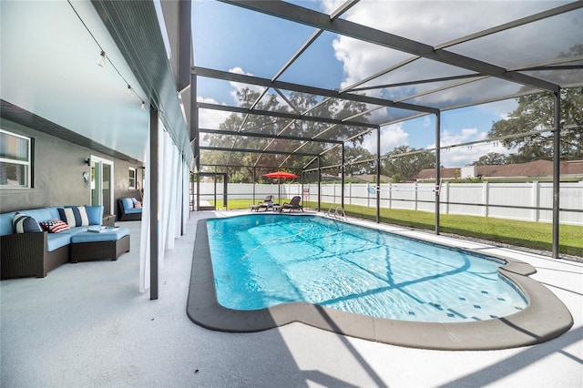 view of pool with a fenced in pool, glass enclosure, a patio area, a fenced backyard, and an outdoor living space