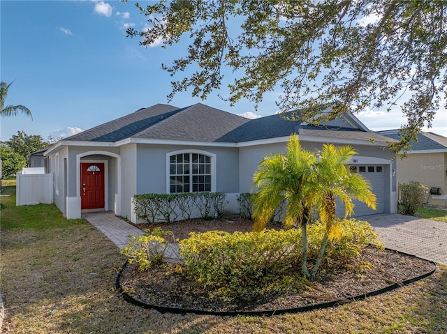 single story home featuring a garage