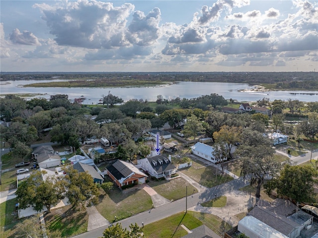 drone / aerial view with a water view