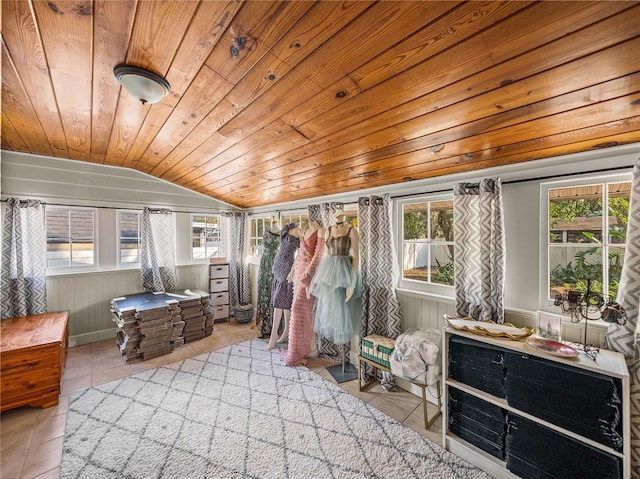 sunroom with plenty of natural light, wooden ceiling, and vaulted ceiling