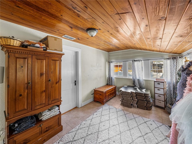 tiled bedroom featuring vaulted ceiling and wooden ceiling