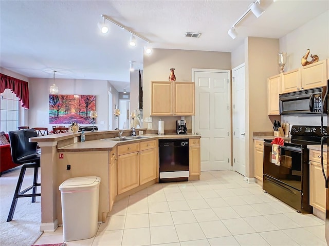 205 Terrace Ridge Cir Unit 205, Davenport, FL 33896 - kitchen with pendant lighting, sink, black appliances, a kitchen bar, and light brown cabinets