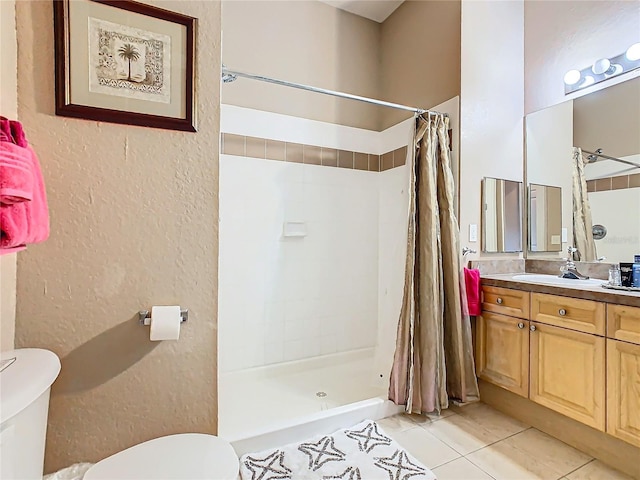 205 Terrace Ridge Cir Unit 205, Davenport, FL 33896 - bathroom featuring tile patterned flooring, vanity, toilet, and a shower with shower curtain
