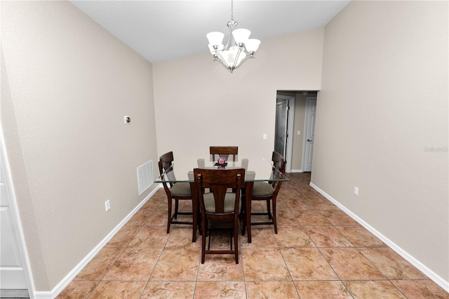 dining room featuring an inviting chandelier, lofted ceiling, and light tile patterned flooring