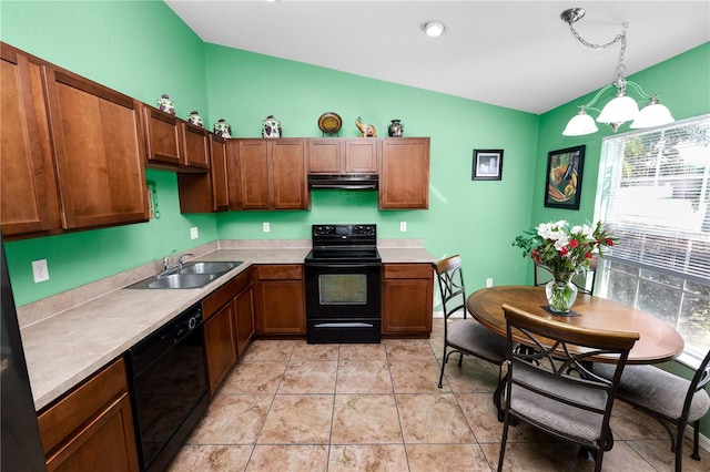 kitchen featuring pendant lighting, sink, black appliances, light tile patterned flooring, and vaulted ceiling