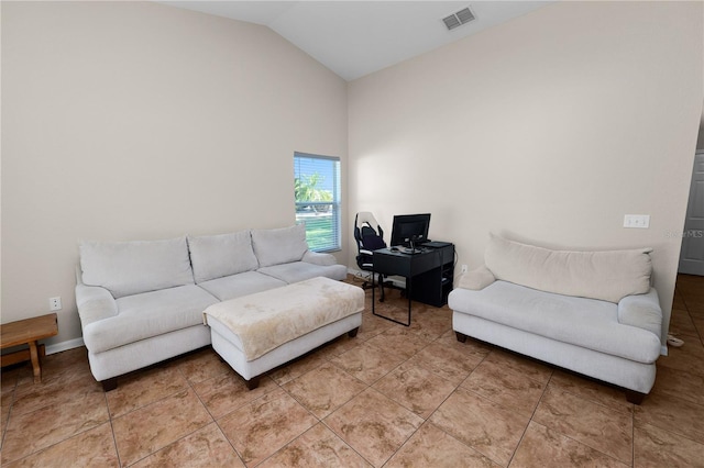 living room featuring tile patterned flooring and lofted ceiling