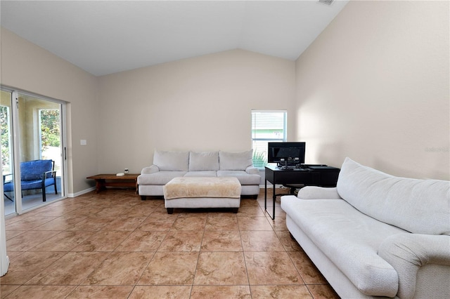 tiled living room featuring lofted ceiling