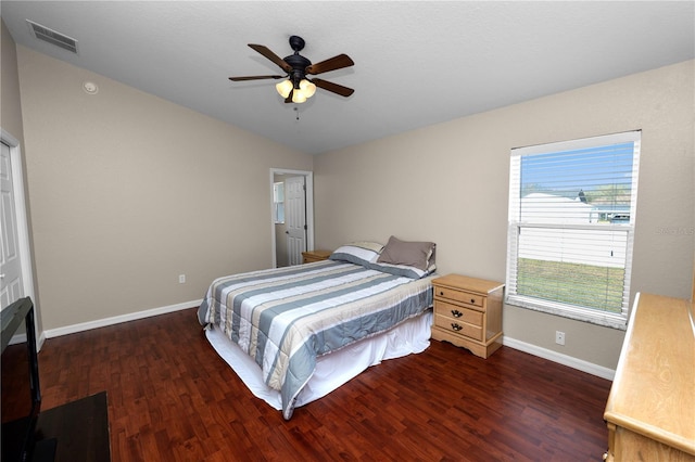 bedroom featuring dark wood-type flooring, ceiling fan, and vaulted ceiling