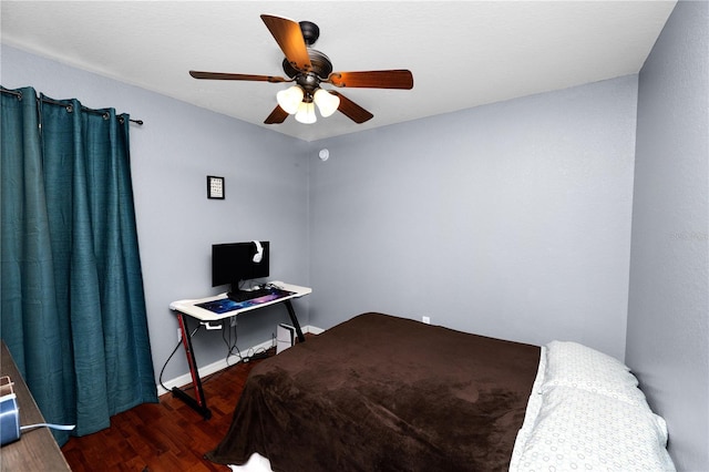 bedroom featuring dark hardwood / wood-style flooring and ceiling fan