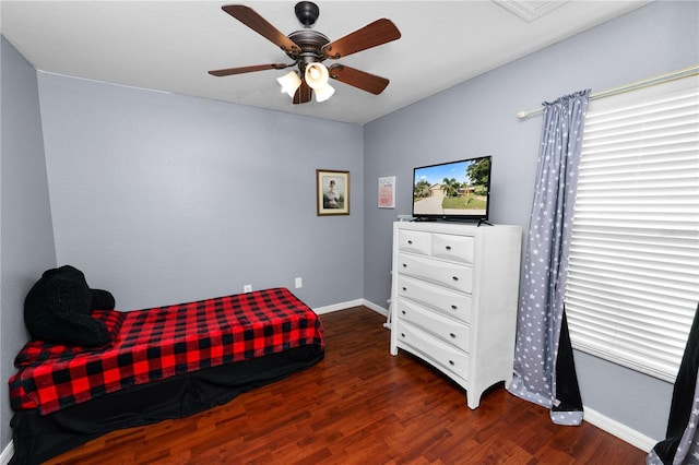 bedroom featuring dark wood-type flooring and ceiling fan