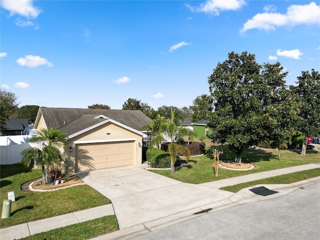 view of front of property with a garage and a front yard