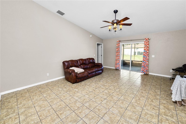 living room featuring ceiling fan, lofted ceiling, and light tile patterned floors