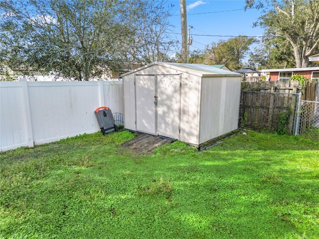 view of outbuilding with a yard