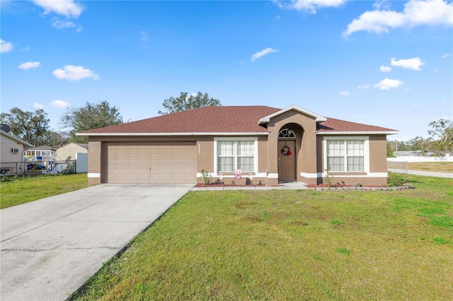 ranch-style home with a garage and a front yard