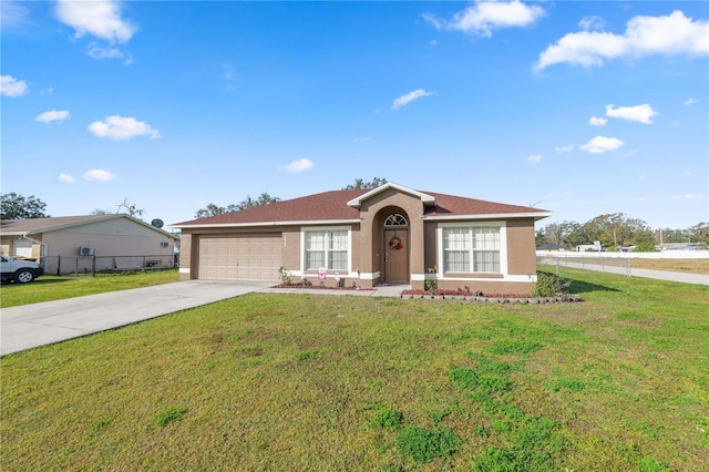 ranch-style home featuring a garage and a front lawn