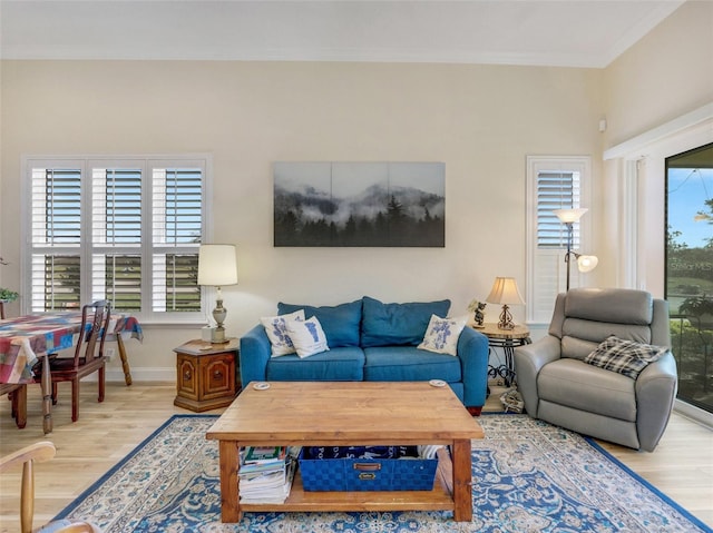 living room with hardwood / wood-style flooring and ornamental molding