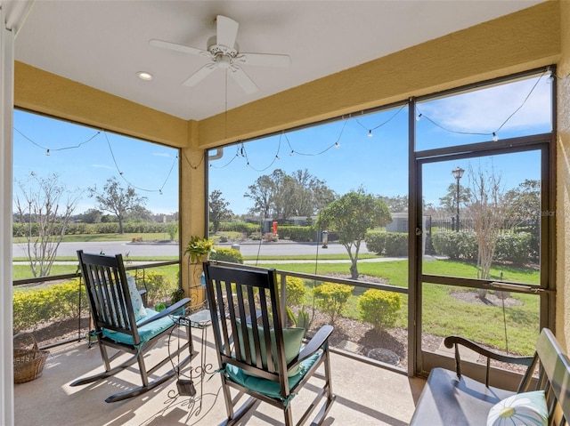 sunroom featuring ceiling fan