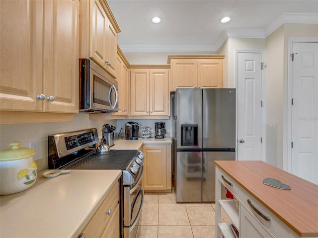 kitchen featuring ornamental molding, appliances with stainless steel finishes, light tile patterned flooring, and light brown cabinetry