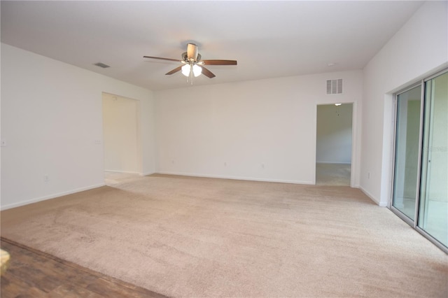 carpeted empty room with ceiling fan