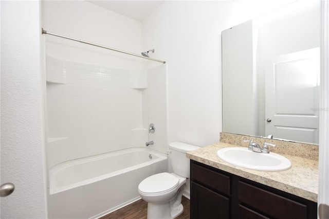 full bathroom featuring washtub / shower combination, vanity, toilet, and wood-type flooring